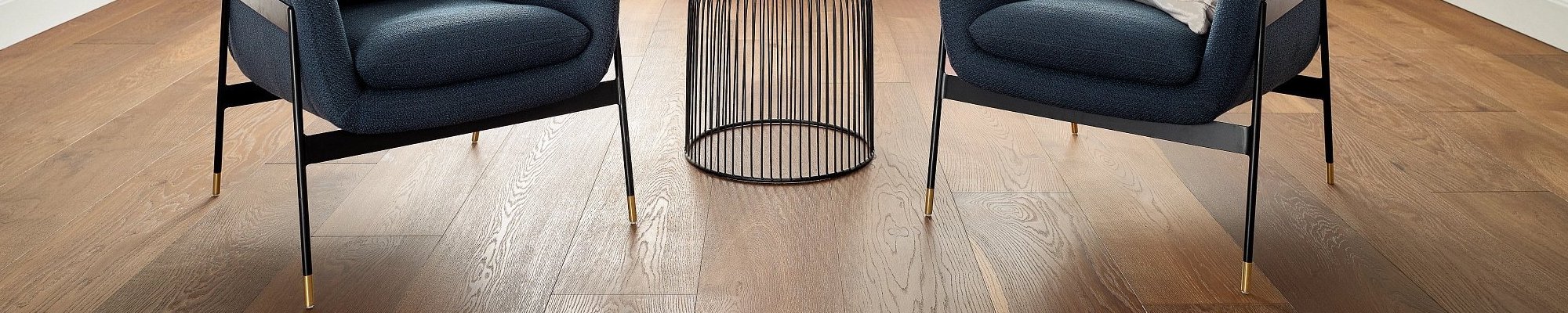 two chairs in a room with a hardwood floor from Five Star Flooring in Gothenburg