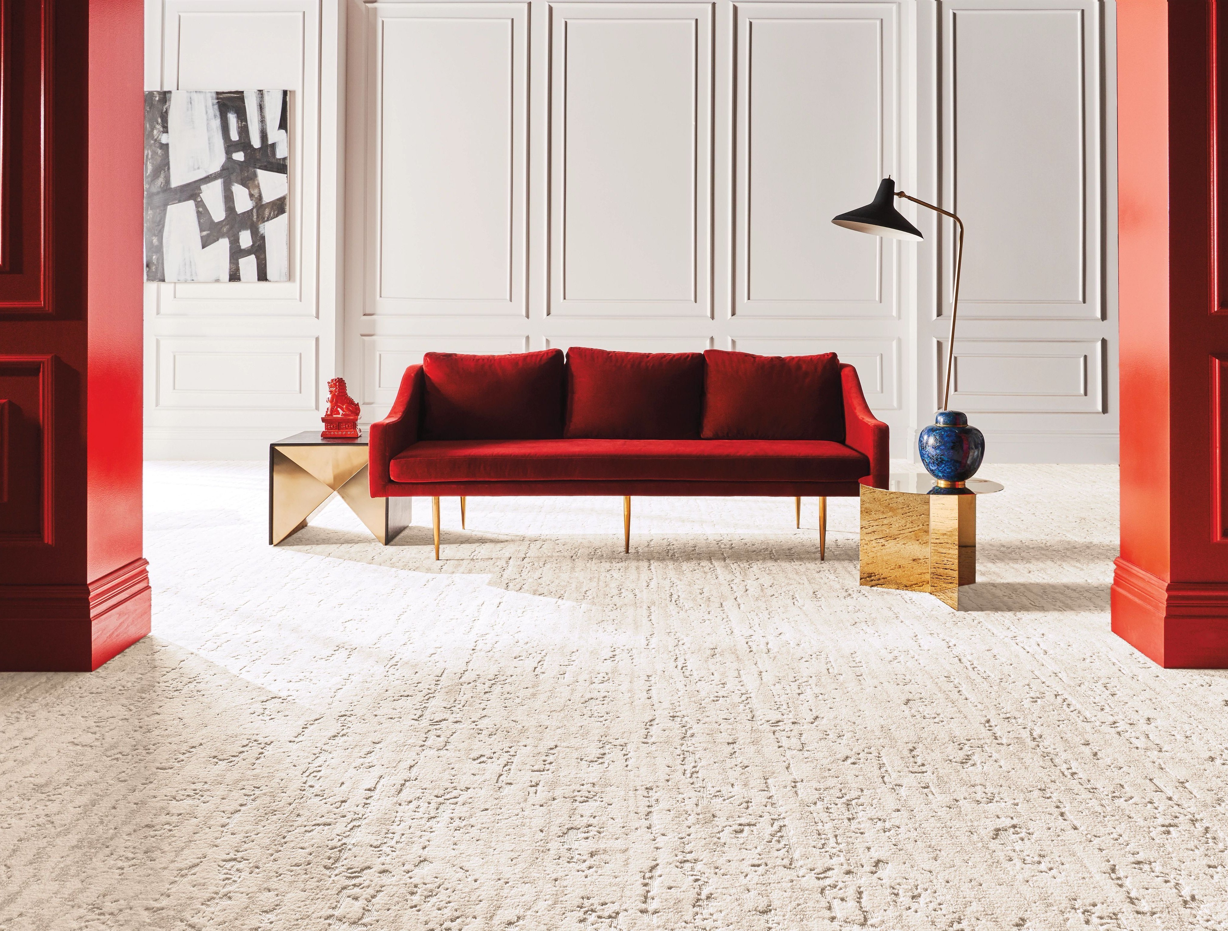 bright carpeted living room with red couch from Five Star in Gothenburg